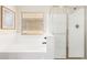 Clean and modern bathroom featuring a shower with glass doors and a soaking tub, perfect for relaxation at 11891 N 147Th Dr, Surprise, AZ 85379