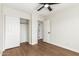 Bedroom featuring a closet, ceiling fan, and an entry to another room at 11891 N 147Th Dr, Surprise, AZ 85379