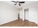 Spacious bedroom with a ceiling fan, closet and natural light streaming in from outdoors at 11891 N 147Th Dr, Surprise, AZ 85379