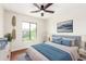 Charming bedroom featuring plush bedding, stylish decor, and a bright, airy atmosphere at 11891 N 147Th Dr, Surprise, AZ 85379