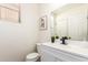 Well-lit powder room with a modern vanity, sleek fixtures, and contemporary decor at 11891 N 147Th Dr, Surprise, AZ 85379