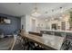 Charming dining area with modern table and chairs, seamlessly connected to a sleek, well-lit kitchen at 13140 W Rowel Rd, Peoria, AZ 85383