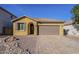 Charming single-story home featuring a paver driveway and low maintenance desert landscaping at 13140 W Rowel Rd, Peoria, AZ 85383