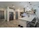 Modern kitchen featuring a large island, stainless steel appliances and floating shelves at 13140 W Rowel Rd, Peoria, AZ 85383