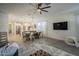Open-concept living area features a spacious layout, stylish decor, and seamless flow to the dining and kitchen areas at 13140 W Rowel Rd, Peoria, AZ 85383
