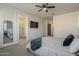 Spacious main bedroom with a flat screen tv, ensuite bathroom, and ensuite shower at 13140 W Rowel Rd, Peoria, AZ 85383