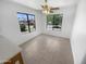 Bright dining area featuring tile floors, a ceiling fan, and natural light from large windows at 14065 W Cornerstone Trl, Surprise, AZ 85374