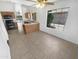 Bright eat-in kitchen featuring tile floors, a ceiling fan, and lots of natural light at 14065 W Cornerstone Trl, Surprise, AZ 85374