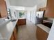 Kitchen with tile floors, stainless steel appliances, and bright natural light at 14065 W Cornerstone Trl, Surprise, AZ 85374