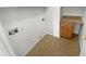 Laundry room with tile flooring and built-in cabinet storage space at 14065 W Cornerstone Trl, Surprise, AZ 85374