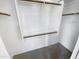 Walk-in closet with custom shelving and rod for ample storage space at 14065 W Cornerstone Trl, Surprise, AZ 85374