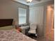 Bedroom with a window and a desk at 15301 W Moreland St, Goodyear, AZ 85338