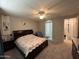 Spacious bedroom with plush carpeting, ceiling fan, and ensuite bath access at 15301 W Moreland St, Goodyear, AZ 85338