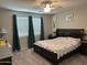 Comfortable bedroom with plush carpet, soft lighting, and neutral walls at 15301 W Moreland St, Goodyear, AZ 85338