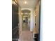 Inviting foyer with neutral walls, tile flooring, and arched openings at 15301 W Moreland St, Goodyear, AZ 85338