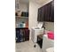 Well-organized laundry room featuring ample shelving and storage cabinets at 15301 W Moreland St, Goodyear, AZ 85338