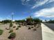 Community playground area with shade structure, play equipment, and desert landscaping at 15301 W Moreland St, Goodyear, AZ 85338