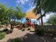 Community playground with shade, slides, and desert landscaping at 15301 W Moreland St, Goodyear, AZ 85338