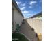 Practical side yard with gravel landscaping and a block wall fence at 15301 W Moreland St, Goodyear, AZ 85338