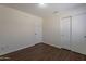 This bedroom features modern wood-look flooring and a spacious closet at 15725 W Lundberg St, Surprise, AZ 85374