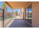 Covered patio area with privacy fencing and a view of the refreshing pool at 15725 W Lundberg St, Surprise, AZ 85374