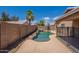Inviting pool and lush landscaping creating a serene and private backyard oasis at 15725 W Lundberg St, Surprise, AZ 85374