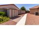 A backyard features ample storage with both green space and rock landscaping at 1625 E Daisy St, Casa Grande, AZ 85122