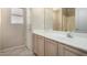 Bathroom featuring large mirror, vanity, and shower at 1625 E Daisy St, Casa Grande, AZ 85122