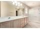 Bright bathroom features double sinks, spacious vanity, and glass enclosed shower at 1625 E Daisy St, Casa Grande, AZ 85122