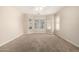 Bright bedroom featuring neutral decor, a ceiling fan, and a bay window allowing ample natural light at 1625 E Daisy St, Casa Grande, AZ 85122