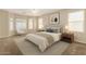Calm primary bedroom with a bay window, neutral paint, and a comfortable bed setup at 1625 E Daisy St, Casa Grande, AZ 85122