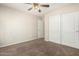 Bedroom featuring ceiling fan and closet with sliding doors at 1625 E Daisy St, Casa Grande, AZ 85122