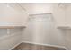 Walk-in closet with wall-mounted shelving and carpeted floor at 1625 E Daisy St, Casa Grande, AZ 85122