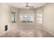 Bright dining area with tile floors, recessed lighting, and multiple windows offering backyard views at 1625 E Daisy St, Casa Grande, AZ 85122