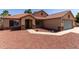 Inviting single-story home featuring desert landscaping, a tile roof, and an attached two-car garage at 1625 E Daisy St, Casa Grande, AZ 85122