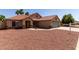Inviting single-story home featuring desert landscaping, a tile roof, and an attached two-car garage at 1625 E Daisy St, Casa Grande, AZ 85122