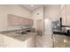 Modern kitchen features stainless steel appliances, granite countertops, and neutral-toned cabinetry at 1625 E Daisy St, Casa Grande, AZ 85122
