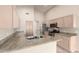 Updated kitchen features stainless steel appliances, granite counters, and light wood cabinetry at 1625 E Daisy St, Casa Grande, AZ 85122