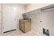 This laundry room features a utility sink with modern fixtures and ample shelving for storage solutions at 1625 E Daisy St, Casa Grande, AZ 85122