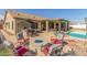 Backyard with a built-in grill area, covered patio and a sparkling pool at 16337 W Pierce St, Goodyear, AZ 85338