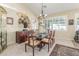 A dining room with decorative wall hangings, ornate chairs, and a lovely chandelier at 16337 W Pierce St, Goodyear, AZ 85338