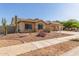 Attractive single-story home with a tile roof and desert landscaping at 16337 W Pierce St, Goodyear, AZ 85338