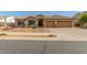 Charming single-story home featuring a tile roof and well-manicured desert landscaping at 16337 W Pierce St, Goodyear, AZ 85338