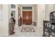Grand foyer with double doors, a tiled floor, and elegant decor at 16337 W Pierce St, Goodyear, AZ 85338
