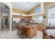 Modern kitchen features stainless steel appliances, granite countertops, and a breakfast bar at 16337 W Pierce St, Goodyear, AZ 85338