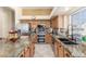 Well-equipped kitchen features stainless steel appliances and granite countertops at 16337 W Pierce St, Goodyear, AZ 85338