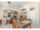 Kitchen with island, granite counters, breakfast bar, and views of the living room at 16337 W Pierce St, Goodyear, AZ 85338