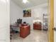 Functional office with a large desk, storage, and good lighting at 16337 W Pierce St, Goodyear, AZ 85338
