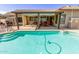 Beautiful backyard pool with a covered patio and built in grill area at 16337 W Pierce St, Goodyear, AZ 85338