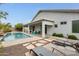 Spacious backyard with private pool, patio, and inviting lounging areas at 16398 N Oachs Dr, Surprise, AZ 85374